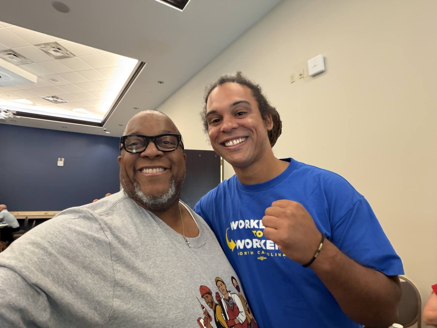 Dr. Charles McKinney (Rhodes College, Memphis) with President Braxton Winston II at the Worker to Worker North Carolina gathering — Greensboro, July 2026